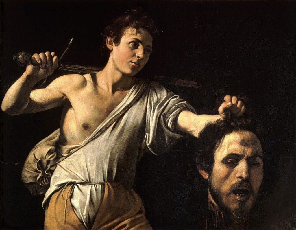 Caravaggio’s “David with the Head of Goliath,” where David holding Goliath’s head is presented as a symbol of remorse and self-reflection.