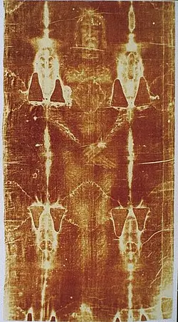 The Shroud of Turin, showing the faint silhouette of a human body in the form of stains.