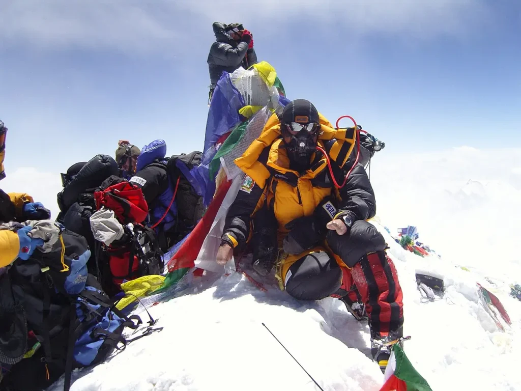 Mountaineer wearing an oxygen mask and high-altitude climbing gear in the Everest Death Zone.