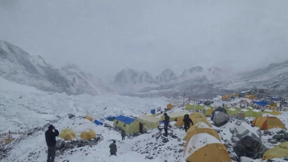 Mountaineering tents on the slopes of Mount Everest during a high-altitude expedition.