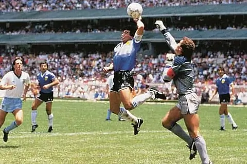 Diego Maradona scoring the “Hand of God” goal against England in the 1986 FIFA World Cup quarter-final.