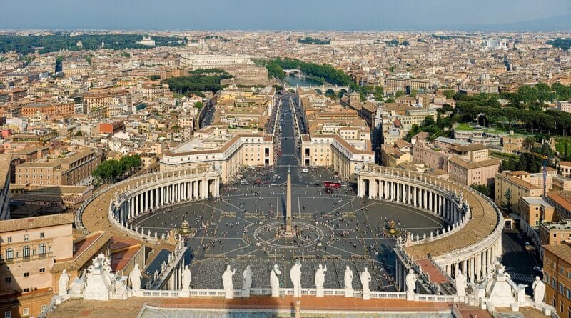 St. Peter’s Square in Vatican City with St. Peter’s Basilica in the background and crowds of visitors