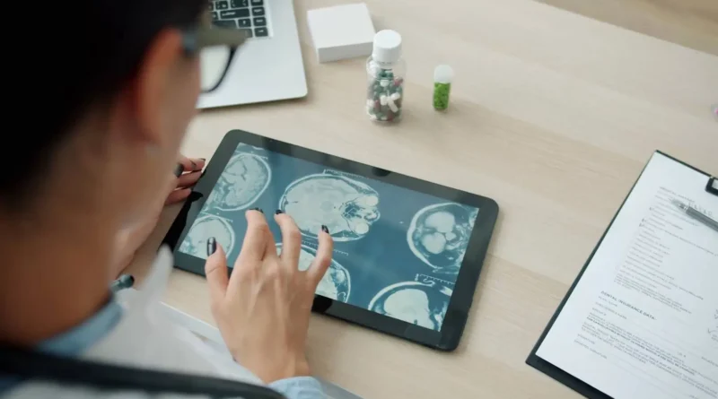 Doctor analyzing an MRI scan on a tablet